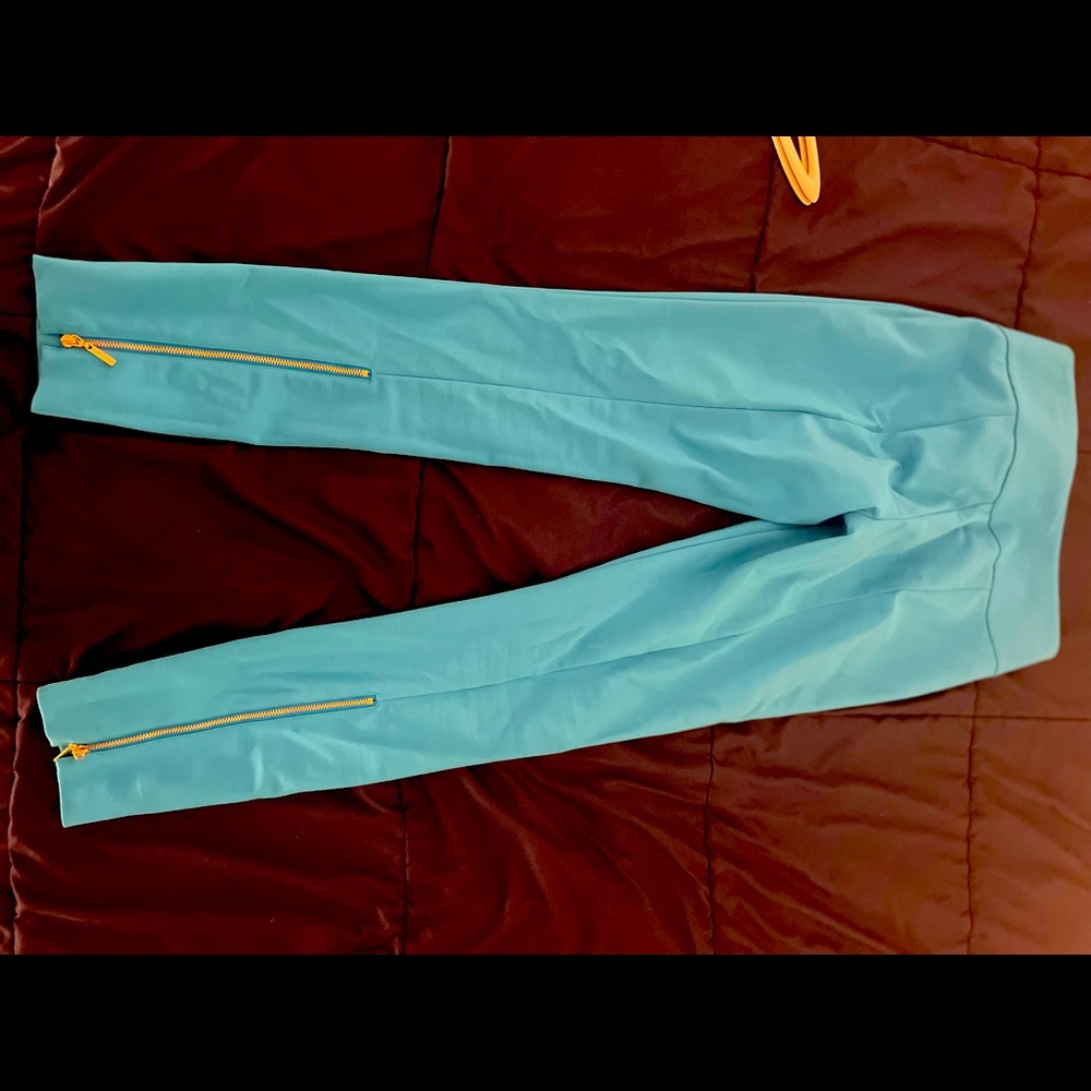 Bright colored aqua blue high waist skinny pants with zippers on the back